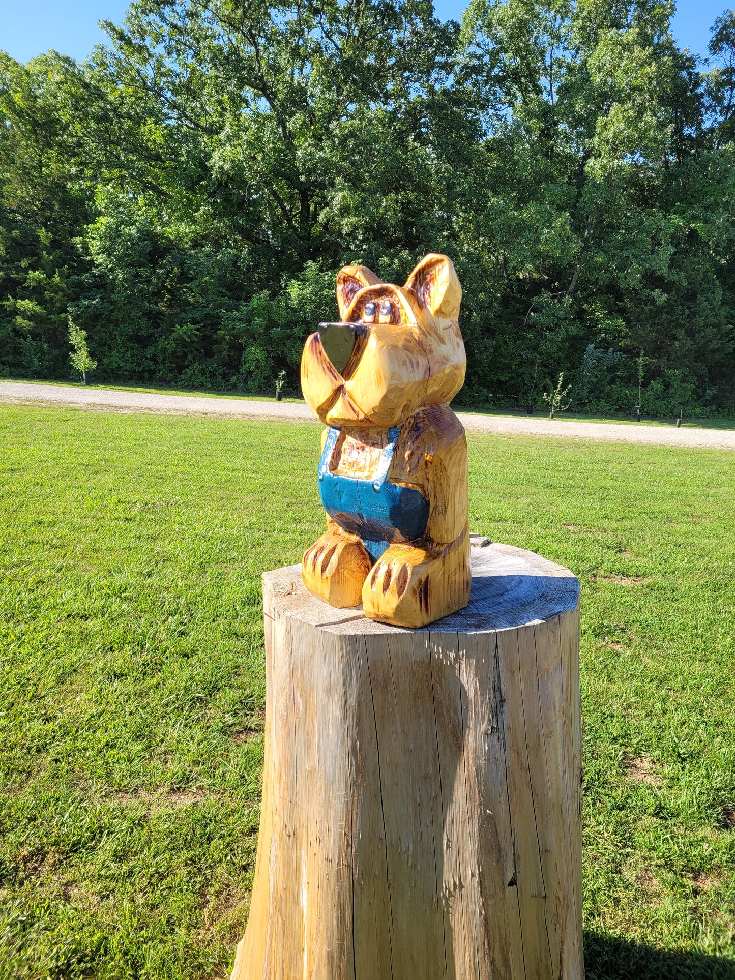 Bear in Suspenders, Chainsaw Carving. 2 ft