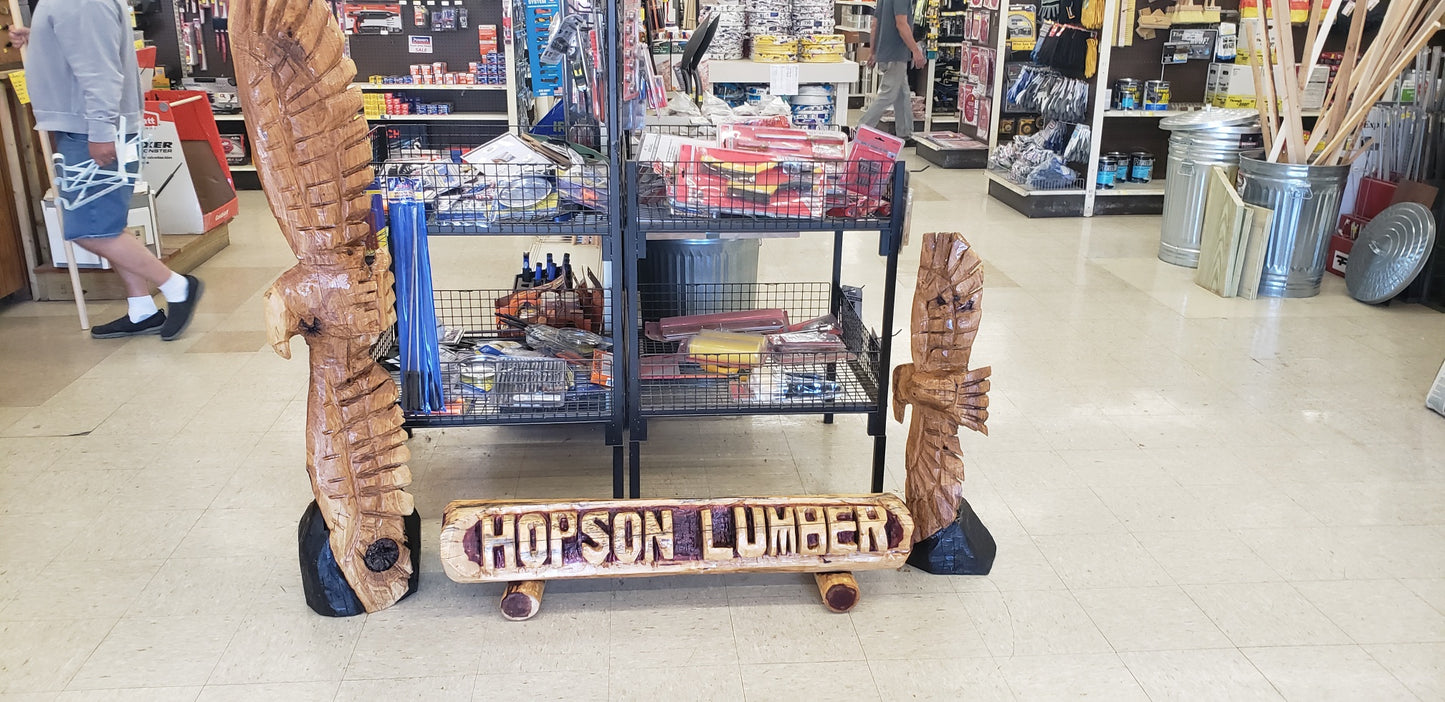 Chainsaw Carving Family Name log, woth two base logs.