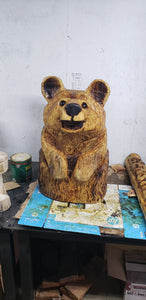Chainsaw Carving Happy Bear in a stump.