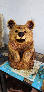 Chainsaw Carving Happy Bear in a stump.