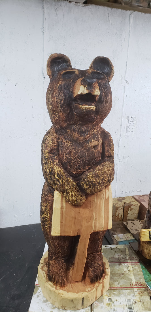 Chainsaw carving 3 ft bear, hand-carved with a persoalized sign.