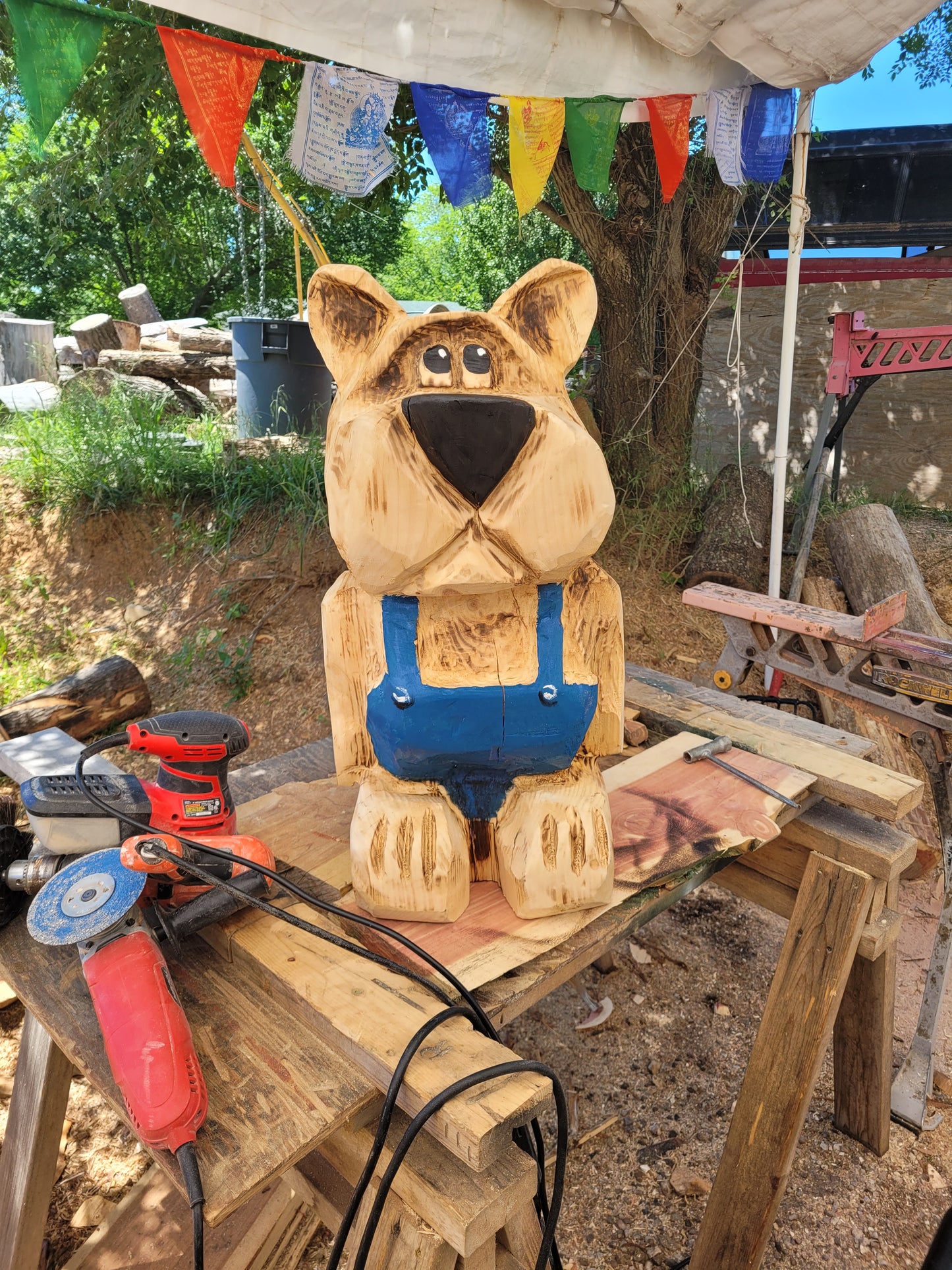 Chainsaw Carving Bear in overalls. 24 inches
