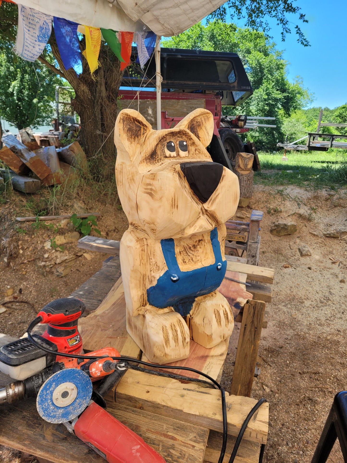 Bear in Suspenders, Chainsaw Carving. 2 ft