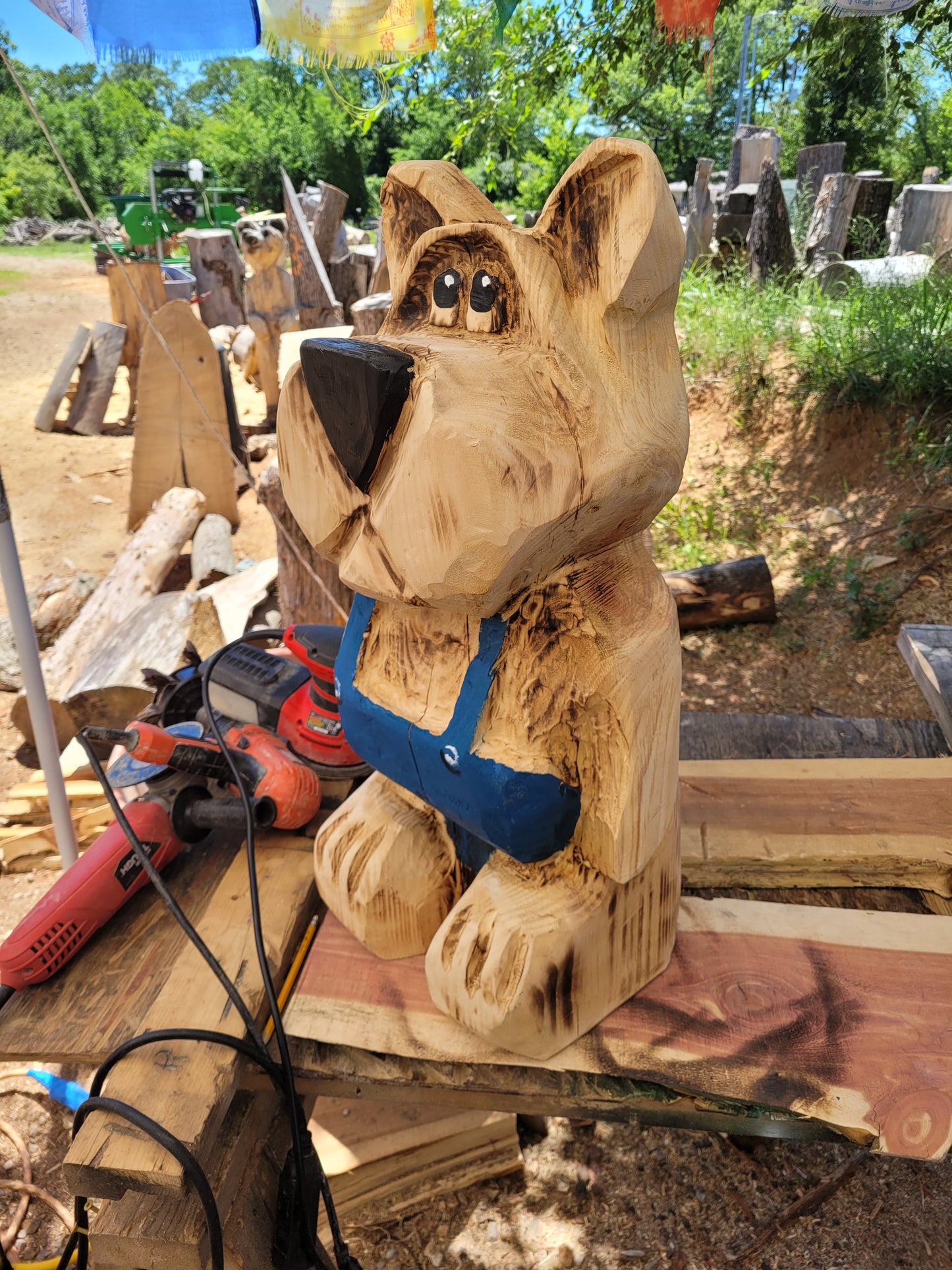 Bear in Suspenders, Chainsaw Carving. 2 ft