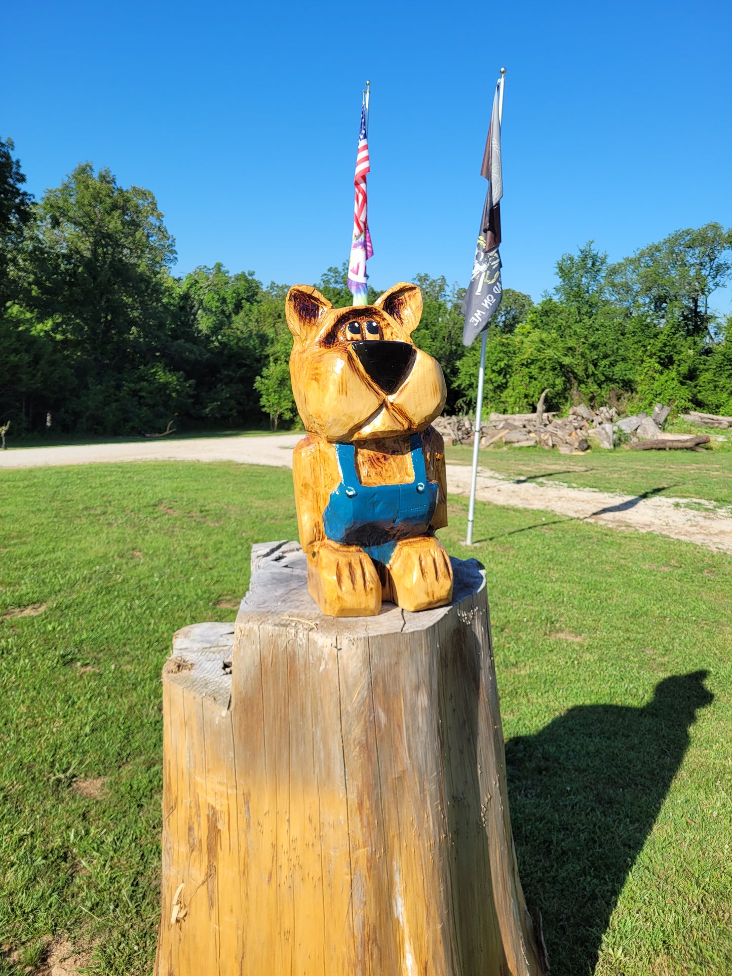 Chainsaw Carving Bear in overalls. 24 inches