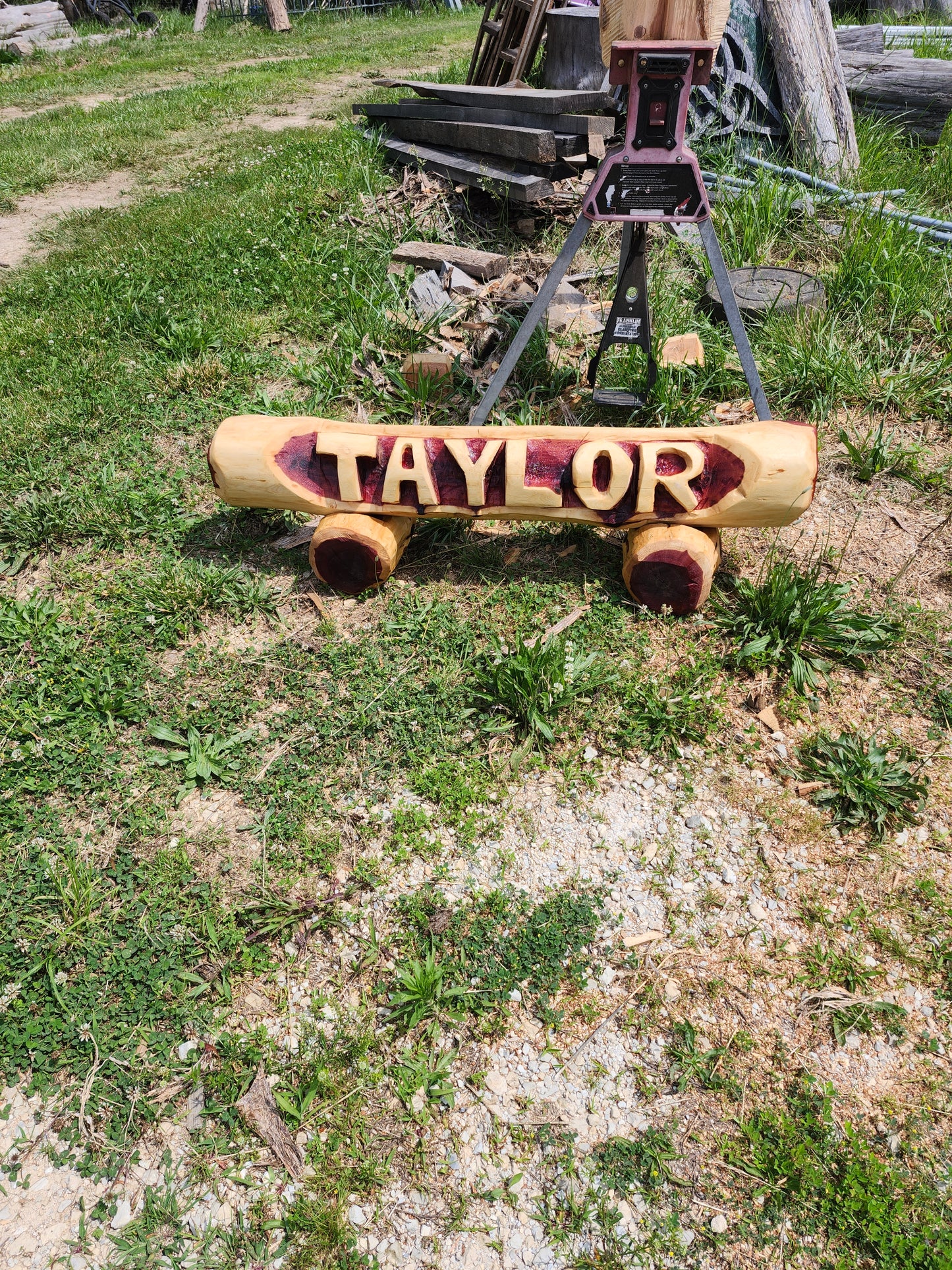Chainsaw Carving Family Name log, woth two base logs.