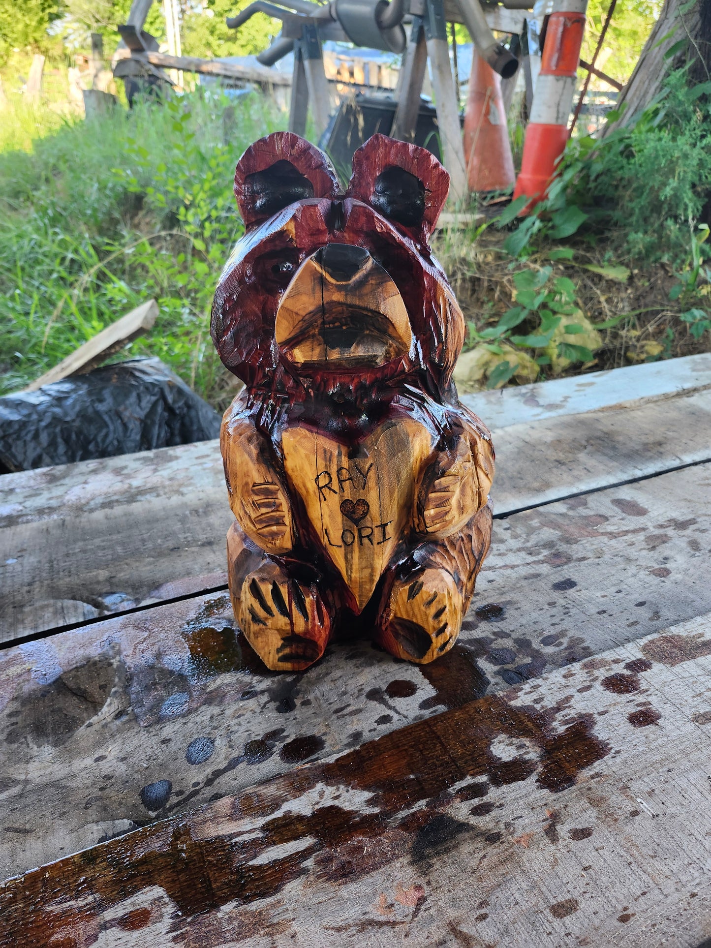 Chainsaw Carving Bear holding heart. 18" tall