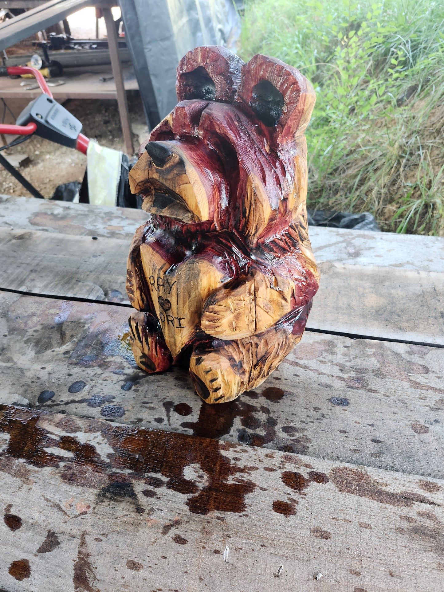 Chainsaw Carving Bear holding heart. 18" tall